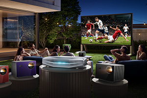 a group of friends lounge in the backyard of a posh home as a football match shows on a massive outdoor screen